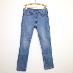 Levi 511 medium wash straight leg, high rise, blank tab jeans